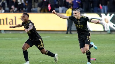 Los Angeles FC defender Diego Palacios and Gareth Bale celebrate after defeating the Philadelphia Union in a penalty shootout to win the MLS Cup. AP