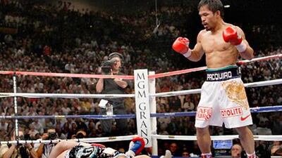Ricky Hatton is knocked down by Manny Pacquiao in their title bout at the MGM Grand Gaden Arena, Las Vegas, in May 2009.