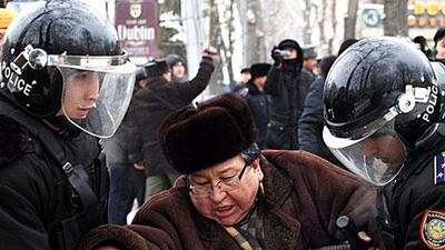 Kazakh riot policemen detain an opposition supporter during a rally in Almaty last week. Clashes and demonstrations are rising in the country.
