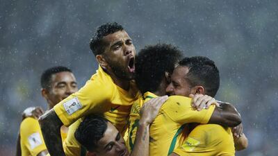 Brazil players celebrate with Willian after the midfielder doubled their lead. Ariana Cubillos / AP Photo