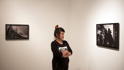 Photographer Xyza Cruz Bacani is working on a documentary about Filipino workers living in the UAE. Aaron Tam / AFP.