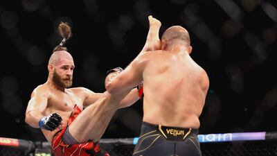 Jiri Prochazka attempts a high kick at Glover Teixeira during their light heavyweight championship fight at UFC 275. Getty