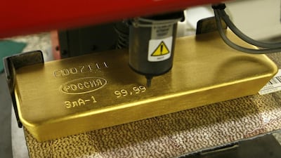 A machine engraves information on an ingot of 99.99 per cent pure gold at the Krastsvetmet in Siberia. Ilya Naymushin / Reuters