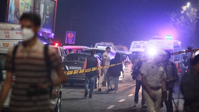Policemen secure the site. AP