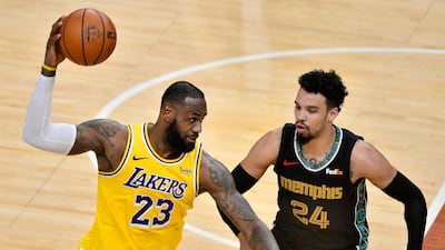 Los Angeles Lakers forward LeBron James handles the ball against Memphis Grizzlies guard Dillon Brooks. AP