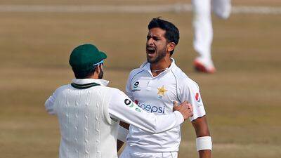 Pakistan's Hasan Ali, right, celebrates after taking the wicket of South Africa's Aiden Markram during the fifth day of the second Test in Rawalpindi. AP