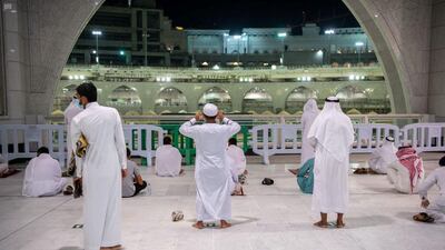 Worshipers perform Al Fajr prayer at the holy mosque in Makkah as it welcomes back public prayers for the first time in seven months. Reuters
