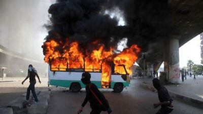 Egyptian protesters set alight a bus belonging to Muslim Brotherhood supporters. Without the aid from governments sympathetic to Egypt's experiment with Islamist governance, the streets might easily be awash in demonstrators.