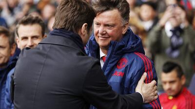 Manchester United manager Louis van Gaal, right, and Tottenham manager Mauricio Pochettino before their match at White Hart Lane on Sunday. Reuters / John Sibley