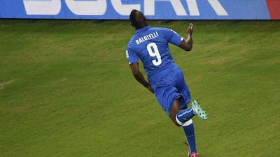 Mario Balotelli celebrates his winning goal against England for Italy in their Group D match at the 2014 World Cup on Saturday. Odd Andersen / AFP