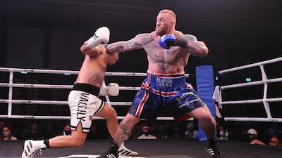 Hafthor Bjornsson, right, of Iceland in action against former Commonwealth Games gold medallist Simon Vallily of England during an exhibition boxing match at the Conrad Dubai Hotel, Dubai. EPA