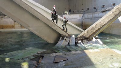 Pro-Syrian regime fighters are seen at the Ain Al Fijeh water pumping station on January 29, 2017. AFP