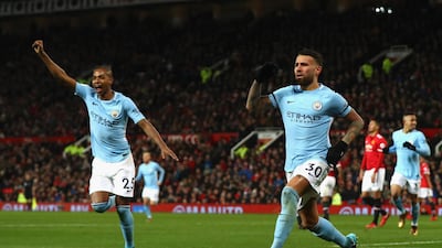 Nicolas Otamendi, right, with Fernandinho, celebrates his winning goal for Manchester City in the Manchester derby. Michael Steele / Getty Images
