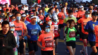 Runners take part in the 2020 Shanghai marathon. AFP