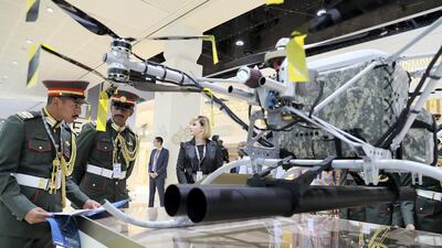Visitors looking the drone UIM which is on display at the Ukrainian Defence Industry stand on the first day of the UMEX held at ADNEC in Abu Dhabi. Pawan Singh / The National