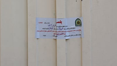 An Iranian police closure notice hangs on the gate of the German Language Institute in Tehran, Iran. EPA