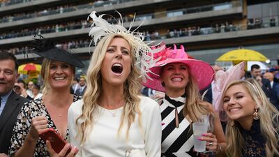 Racegoers cheer on their horse on day two of the Royal Ascot horse racing meet, in Ascot, west of London. AFP