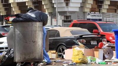Overflowing bins are seen in Abu Dhabi. The municipality has now launched a hygiene campaign to keep the city clean.