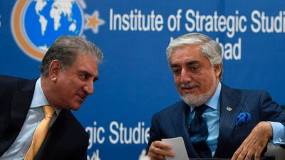 Pakistan's Foreign Minister Shah Mahmood Qureshi, left, speaks with the chairman of Afghanistan's High Council for National Reconciliation Abdullah Abdullah during an event at the Institute of Strategic Studies in Islamabad on September 29, 2020. AFP