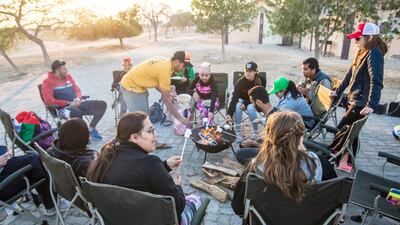 Young adults with special needs on a day trip to Al Futaisi island off Abu Dhabi. It was the first outdoor trip without their family for the UAE residents with disabilities. Courtesy Wake Up Adventures