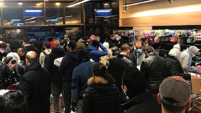 Shoppers fill a local supermarket shortly after the announcement of a curfew in Amman, Jordan. EPA