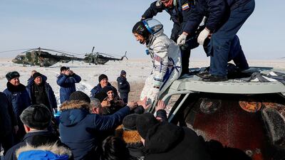 Specialists help Nasa astronaut Christina Koch shortly after landing of the Russian Soyuz MS-13 space capsule in a remote area southeast of Zhezkazgan in the Karaganda region of Kazakhstan. Reuters