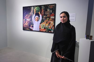 Dhabia AlMansoori with one of her works. Victor Besa / The National