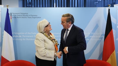 French Defence Minister Catherine Vautrin and her German counterpart Boris Pistorius shake hands after a signing ceremony at Nato headquarters in Brussels. AP