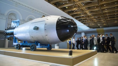 People look at a replica of a Soviet AN-602, or Tsar Bomb, the most powerful nuclear bomb ever detonated, which is now on display at Manezh in Moscow on September 1. Pavel Golovkin/AP