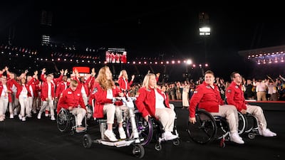 Team England wore bright red jackets by Scottish fashion designer Patrick Grant. Getty Images