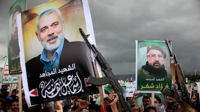 Houthi supporters hold placards with pictures of late Hamas political leader Ismail Haniyeh and Hezbollah senior commander Fouad Shukr during a protest, in Sanaa, Yemen, on August 2. EPA