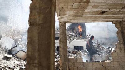 A man walks amid the rubble of destroyed buildings following a Syrian government air strike on the rebel-held town of Douma, on the eastern outskirts of the capital Damascus, on February 26, 2017. Abd Doumany / AFP