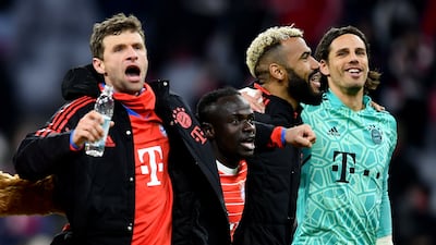 Thomas Muller, left, celebrates with teammates after the match. EPA