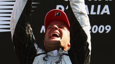 Rubens Barrichello celebrates on the podium after winning the Italian Grand Prix in Monza yesterday.