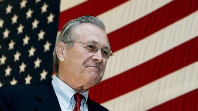Donald Rumsfeld arrives on stage to address troops in Bagram, Afghanistan, on December 22, 2005. Reuters