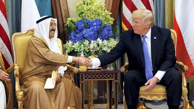 Emir of Kuwait Sabah Al Ahmad Al Jaber Al Sabah shakes hands with US president Donald Trump during their meeting in Riyadh, Saudi Arabia, on May 21, 2017. Jonathan Ernst / Reuters