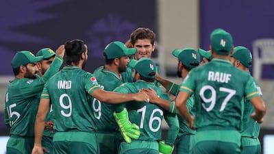 Pakistan players celebrate with Shaheen Afridi after the dismissal of India's KL Rahul during the 2021 T20 World Cup in Dubai. AP