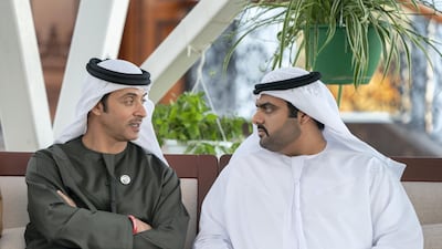 Sheikh Hazza bin Zayed Al Nahyan speaks with Sheikh Mohamed bin Hamad Al Sharqi during a Sea Palace barza. Rashed Al Mansoori / Ministry of Presidential Affairs
