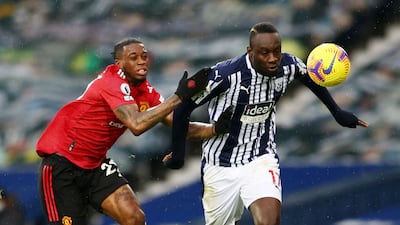 West Brom's Mbaye Diagne battles with United defender Aaron Wan-Bissaka. Reuters