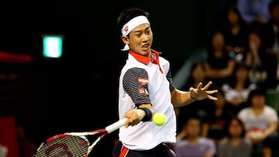 Kei Nishikori returns a shot to Ivan Dodig during his second round victory on Wednesday at the Japan Open in Tokyo. Koji Watanabe / Getty Images / October 1, 2014
