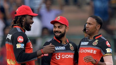 The opening partnership between Chris Gayle, left, and Virat Kohli, centre, set the foundations for the Royal Challengers Bangalore. Manjunath Kiran / AFP