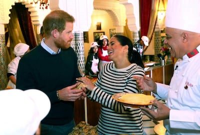 Britain's Prince Harry and Meghan, Duchess of Sussex, at a cooking school demonstration at the Villa des Ambassadors in Rabat, Morocco. AP