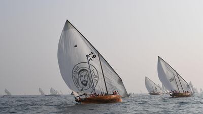 Emirati competitors sail their dhows in the Arabian Gulf.