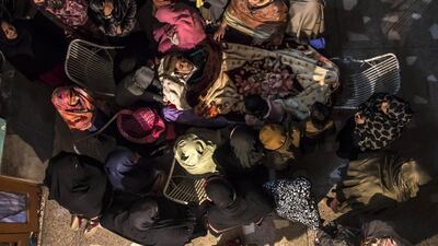 Women mourn as they surround the body of their relative Osama Taher, 15, a student who was killed during an attack by Taliban gunmen on the Army Public School, at his house in Peshawar on December 16. Zohra Bensemra / Reuters