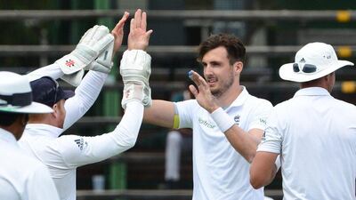 Steven Finn of England celebrates the wicket of Hashim Amla of the Proteas with his team mates during day 1 of the 3rd Test match between South Africa and England at Bidvest Wanderers Stadium on January 14, 2016 in Johannesburg, South Africa. (Photo by Lee Warren/Gallo Images/Getty Images)