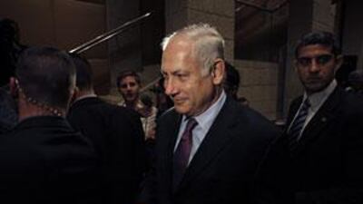 Benjamin Netanyahu leaves after speaking at a conference in Jerusalem today.