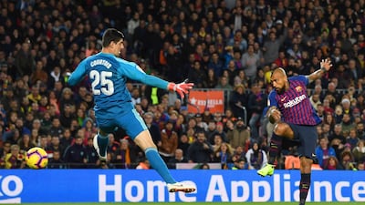 Arturo Vidal of Barcelona scores his sides fifth goal past Thibaut Courtois of Real Madrid during the La Liga match between FC Barcelona and Real Madrid CF at Camp Nou in Barcelona, Spain. Getty Images