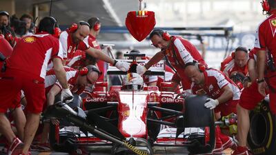 Ferrari driver Sebastian Vettel comes in for a tire change during the third free practice session. Ahmed Jadallah / Reuters
