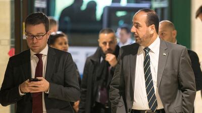 Nasr Al Hariri, right, head of the Syrian opposition delegation to the UN-brokered talks in Geneva, arrives for a meeting with UN special envoy Staffan de Mistura at the European headquarters of the United Nations on December 12, 2017. Xu Jinquan / pool photo via AP