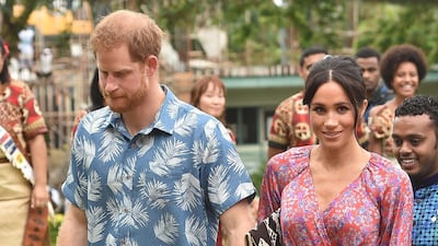 Meghan, Duchess of Sussex wears a Figue dress and Castaner wedges at the University of the South Pacific in Suva on October 24, 2018. AFP
